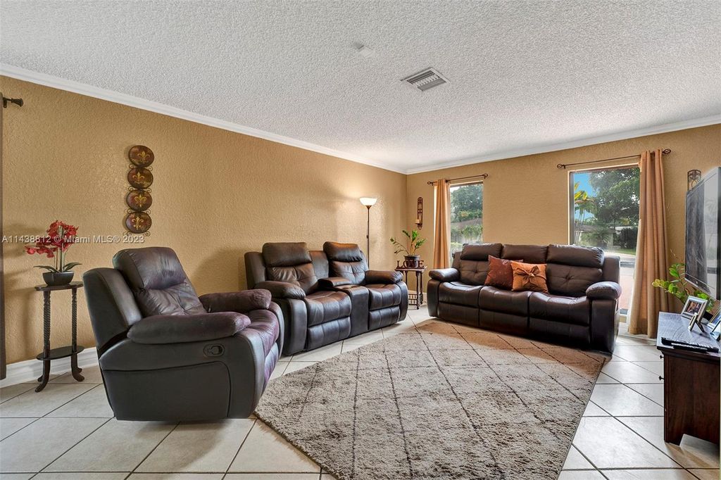 Photo of 2068 NW 100th Way, Coral Springs, FL 33071 (MLS # A11438812)