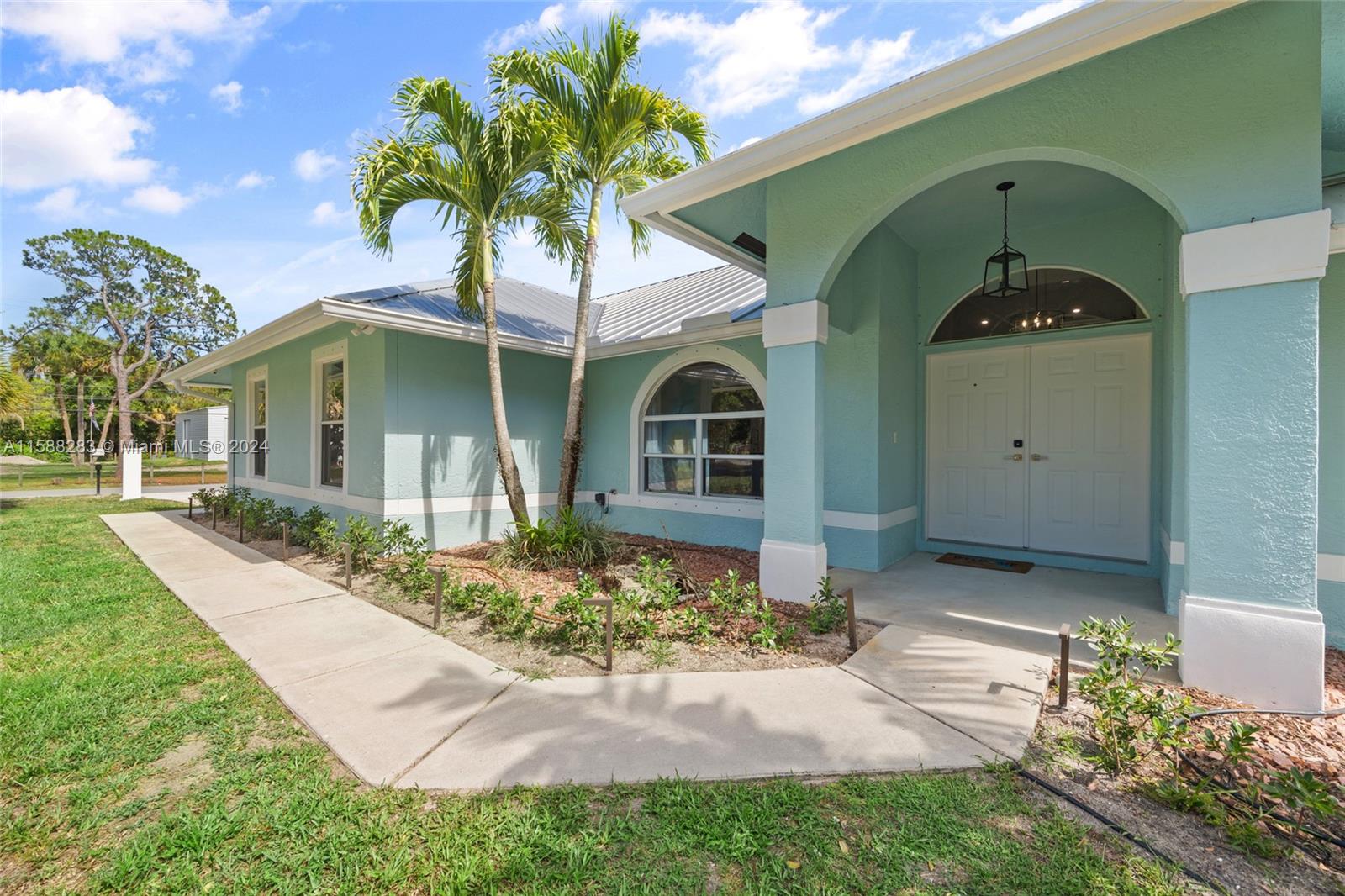 Discover your paradise nestled on 1.2 acres of lush land in Jupiter near hiking, biking and horse trails. This home renovated in 2023 including new Central Air. Open floor plan offers luxury and convenience. It is the ultimate haven for discerning homeowners. Kitchen has large island with seating area. Laundry with built in cabinetry. Master bedroom with walk in closets. New porcelain tile throughout home. Large saltwater pool, travertine tile pool deck, fire pit, hot tub and outdoor sauna. Screened patio for year-round enjoyment. Spacious 1-story layout with a split floor plan. Space for all hobbies, RV and boat. Home construction is Royal wall. Whole house water filtration system and outdoor camera system. Don't miss out on the opportunity to make this Jupiter retreat your own.