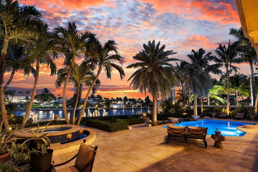Intracoastal estate epitomizes sophistication and modern luxury, boasting 6 ensuite bedrooms, 8 full and 2 half baths, spanning just under 10,000 SF, with a 4-car garage. Its open design, featuring Venetian plaster walls and tray ceilings in warm tones, maximizes the breathtaking views. Situated 1 mile north of Hillsboro Inlet, the estate includes a foyer, great room, elevator, both formal & casual dining rooms, wine room, game room, and a gourmet kitchen with a gas stove on the main floor. The upper level houses a primary suite with a private balcony, dual bathrooms, 4 additional guest suites, a home theater, and an office. Outdoors, one can unwind with a luminous saltwater pool, spa, summer kitchen, 16k boat lift plus jet ski floater on a concrete dock that accommodates an 85ft yacht.