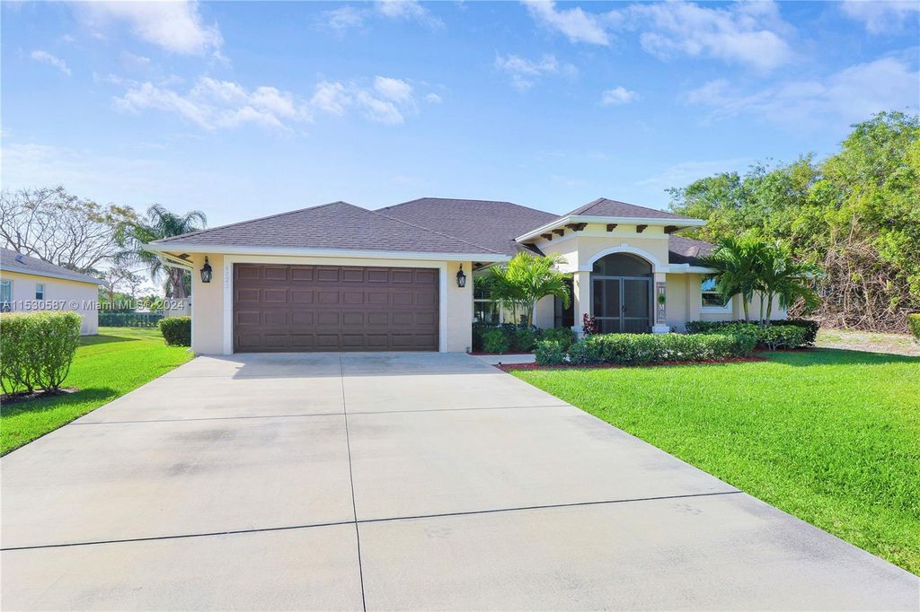 Photo of 6022 NW Wolverine Rd, Port Saint Lucie, FL 34986 (MLS # A11530587)