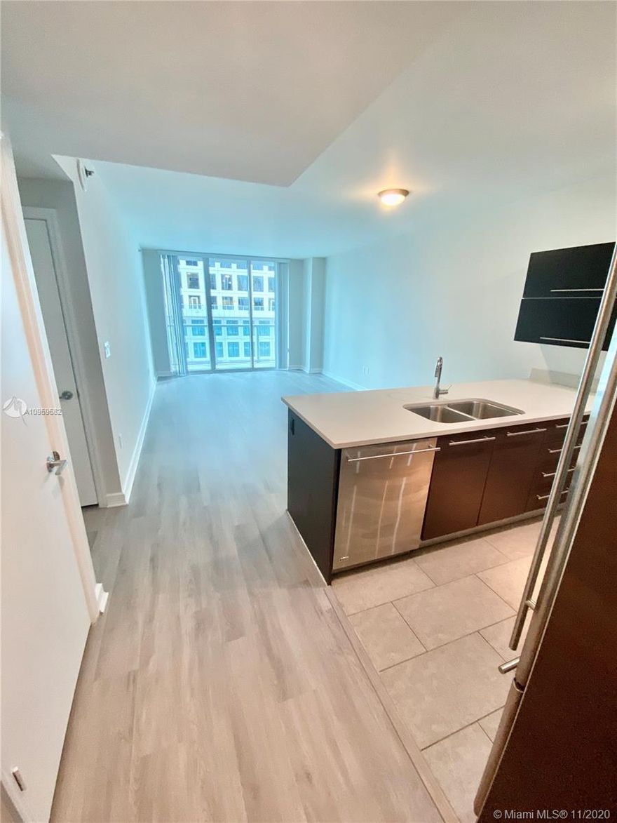 Spacious 1 bed unit in the heart of the financial district on Brickell Avenue. Unit features: European style kitchen with stainless steel appliances; like wood flooring throughout just installed, walk in closet and pantry; unit freshly painted, both shower and bathtub in bathroom, nice balcony to enjoy Miami's weather!. Building has excellent amenities like rooftop (heated) pool on the 42nd floor, pool deck with amazing views of bay and downtown; walking distance from Brickell City Center, many restaurants, supermarket and much more!.