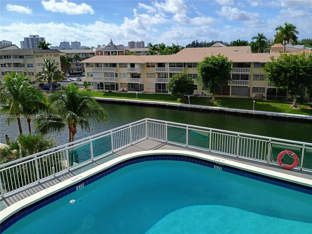 Photo of 437 Golden Isles Dr #4J, Hallandale Beach, FL 33009 (MLS # A12003436)