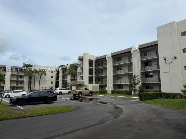 Photo of 9420 Poinciana Pl #407, Davie, FL 33324 (MLS # A12066443)