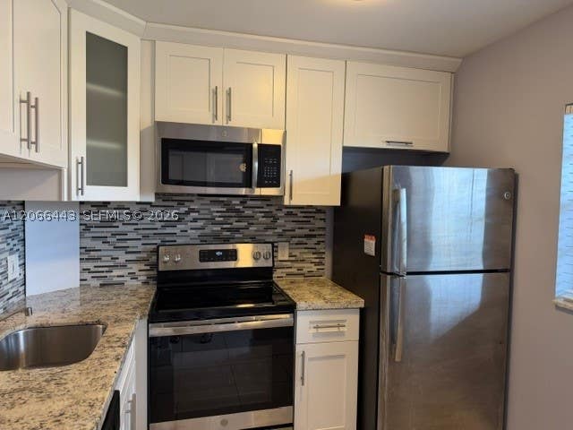 Photo of 9420 Poinciana Pl #407, Davie, FL 33324 (MLS # A12066443)