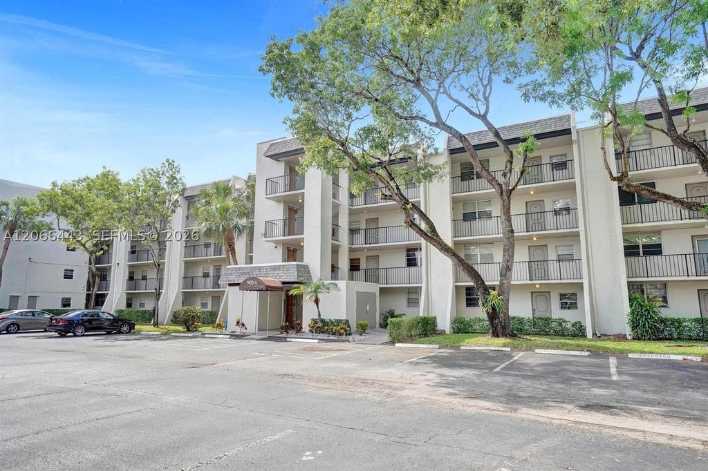 Photo of 9420 Poinciana Pl #407, Davie, FL 33324 (MLS # A12066443)