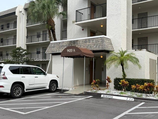 Photo of 9420 Poinciana Pl #407, Davie, FL 33324 (MLS # A12066443)