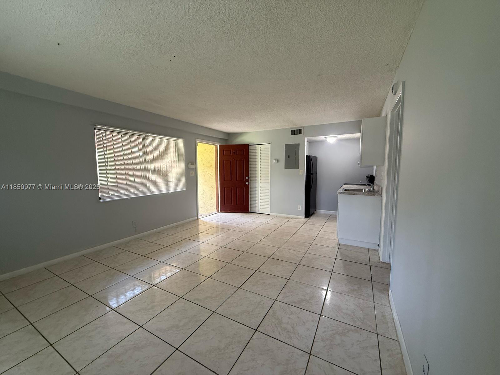 Spacious and beautifully updated 1-bedroom, 1-bath unit featuring fresh paint and tile flooring throughout. This well-maintained residence offers central A/C, in-unit laundry, and includes water, sewer, and trash in the monthly rent. Conveniently located near major highways including the Turnpike and I-95, as well as shopping centers, restaurants, and public transportation. Fast and straightforward approval process. Easy to show. A must-see opportunity for qualified tenants.