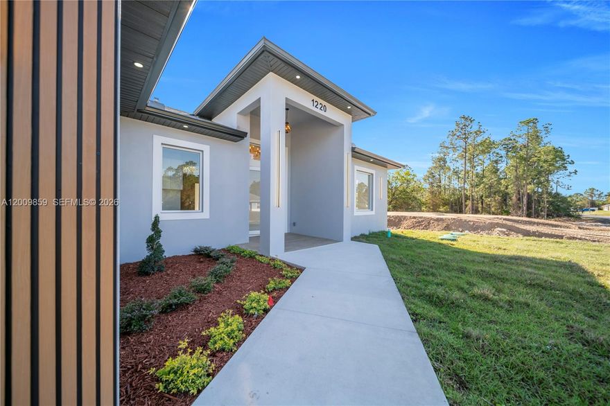 Welcome to this stunning 4-bedroom, 3-full-bath home nestled on a generous half-acre lot, where luxury finishes meet thoughtful design at every turn. A split floor plan provides the perfect balance of privacy and functionality — two bedrooms share a beautifully appointed full bath, while a third bedroom enjoys its own private en-suite with direct access to the lanai, creating an ideal retreat for guests or in-laws.

The master suite is a true sanctuary, featuring a spa-like en-suite bath with dual vanity sinks and upscale finishes. The chef-inspired kitchen impresses with rich granite countertops and a matching granite backsplash throughout. Peace of mind comes standard with impact-resistant windows and doors, while the 2-car garage adds everyday convenience.

With room for everyone to grow, play, and make memories, this home is the perfect place to raise a family in comfort and style.
