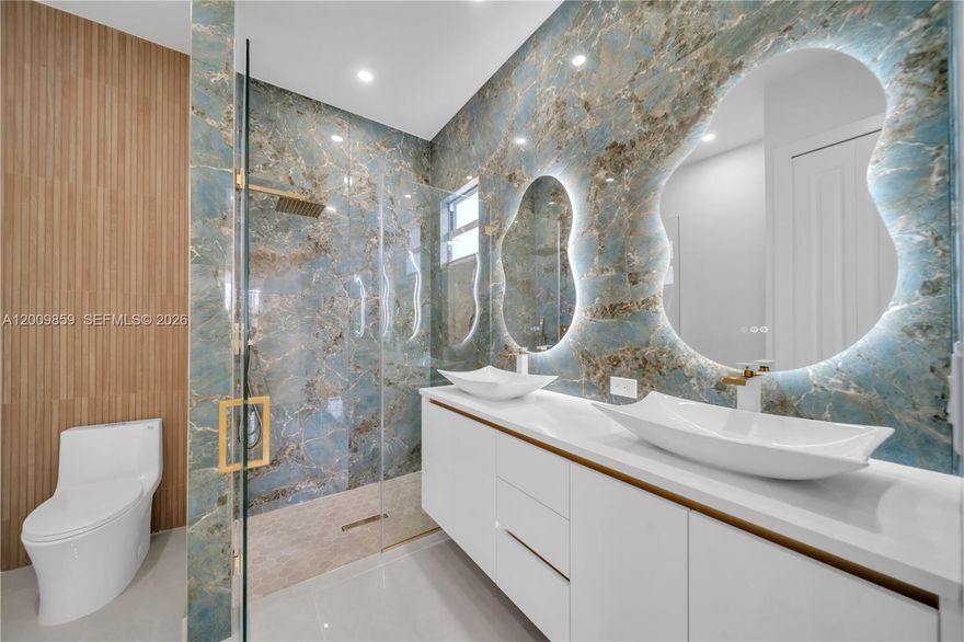 Welcome to this stunning 4-bedroom, 3-full-bath home nestled on a generous half-acre lot, where luxury finishes meet thoughtful design at every turn. A split floor plan provides the perfect balance of privacy and functionality — two bedrooms share a beautifully appointed full bath, while a third bedroom enjoys its own private en-suite with direct access to the lanai, creating an ideal retreat for guests or in-laws.

The master suite is a true sanctuary, featuring a spa-like en-suite bath with dual vanity sinks and upscale finishes. The chef-inspired kitchen impresses with rich granite countertops and a matching granite backsplash throughout. Peace of mind comes standard with impact-resistant windows and doors, while the 2-car garage adds everyday convenience.

With room for everyone to grow, play, and make memories, this home is the perfect place to raise a family in comfort and style.
