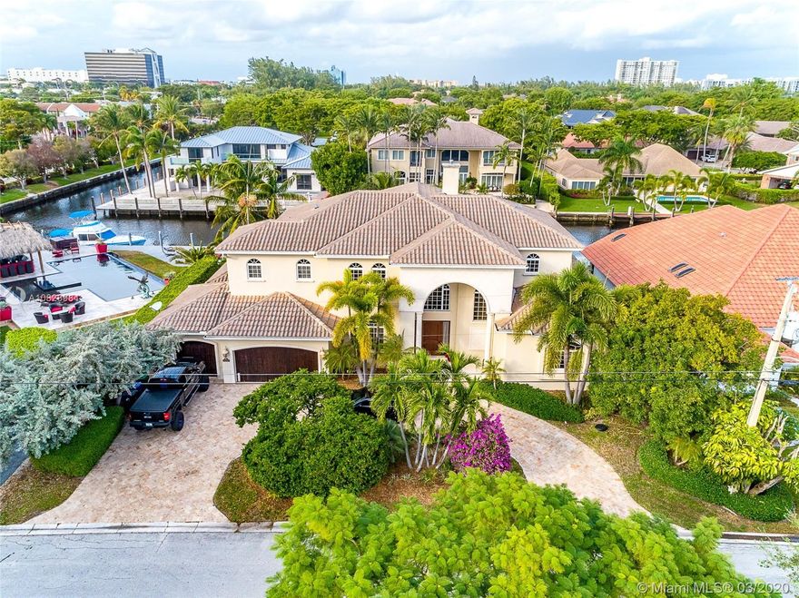 Gorgeous 2-story home. Wood dock with 100 feet of deep water, no fixed bridges. 6 BR, 6.5 BA. 6355 SF. 11,000 SF lot. 3 Car garage, elevator. Gourmet kitchen with eat in area, family room overlooking the water, 2 laundry room.Master suite and office downstairs. master suite with sitting area and morning bar, upstairs 4 additional bedrooms, large covered terrace with water view and loft area. salt water pool, spa & summer kitchen. Entire house freshly painted, new A/C and newly redone, landscape throughout. 5 mins to one of the best private schools Pine Crest.