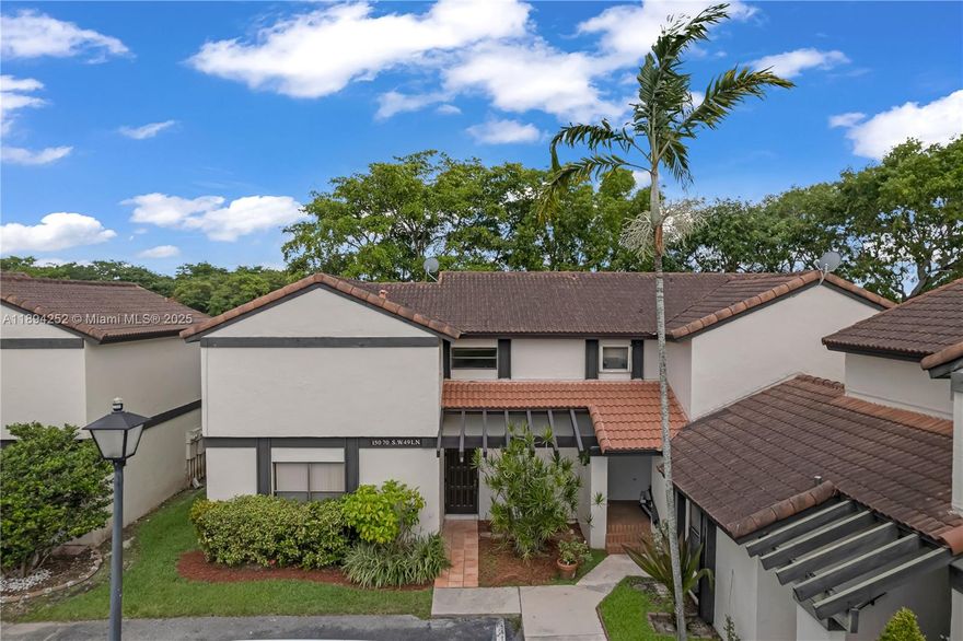 Enjoy sunrises and sunsets in this lake front townhouse in desired Lakes of the Meadows community. Corner home with direct lake access and additional community pool for Village Homes residents. 2 bedrooms and 2 1/2 bathrooms with split level floor plan and a breakfast countertop in the kitchen. Appliances include tankless water heater, dryer, refrigerator, microwave, new dual heating stove top range and new washing machine. Laundry room/utility room is conveniently located by the family room and can be closed off. Spacious master bedroom has a walk in closet, closed off bathroom and direct access to balcony that overlooks the lake.