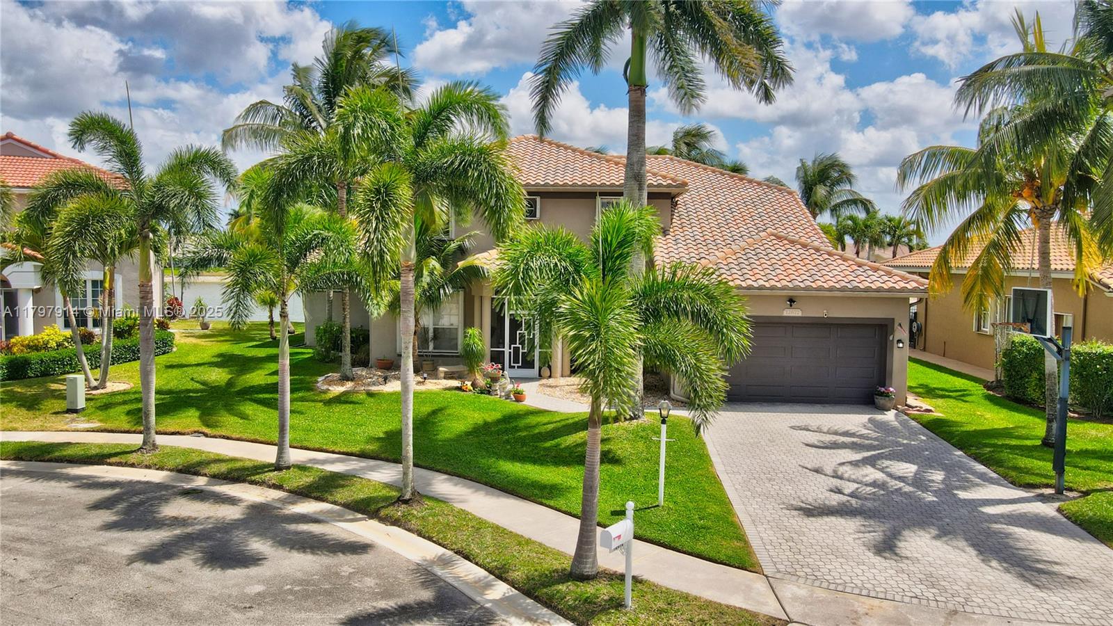 Replacing 2 brand new ACs, this 3,602 sq. ft. home is in a large cul-de-sac with outstanding long lake views. Move-in-ready 5-bed, 4-bath offers ample space, including a remarkably large suite downstairs with two walk-in closets and another impressive suite upstairs. The kitchen features matching granite countertops and a custom granite kitchen table, complemented by stainless steel appliances. Outside, the 1/4 acre lot offers abundant space and a direct connection to nature, while the waterfront screened pool promises endless fun and relaxation. Perfect for both entertaining and everyday family life, located in a quiet neighborhood where you can walk to 3 A-rated schools. This house feels like home and offers peace and privacy. AN ABSOLUTE MUST-SEE! SCHEDULE A TOUR TODAY!