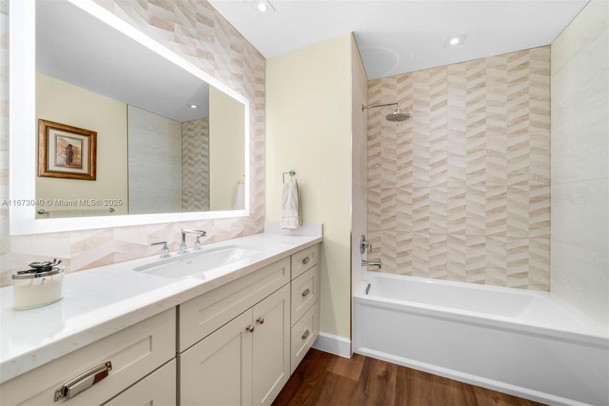 Step into this beautifully remodeled one-story home, tastefully updated in 2019 and situated on a spacious corner lot. The open split floor plan welcomes you with abundant natural light streaming through impact glass windows. The recently upgraded kitchen, featuring views of the lush backyard, blends seamlessly with the cozy living area—perfect for everything from relaxed evenings to lively get-togethers. The primary suite serves as a tranquil escape, offering serene views of the sparkling pool and verdant surroundings. Outside, a covered terrace with ambient lighting, a comfortable sitting area, and a BBQ setup provides the perfect ambiance for alfresco dining and entertaining.