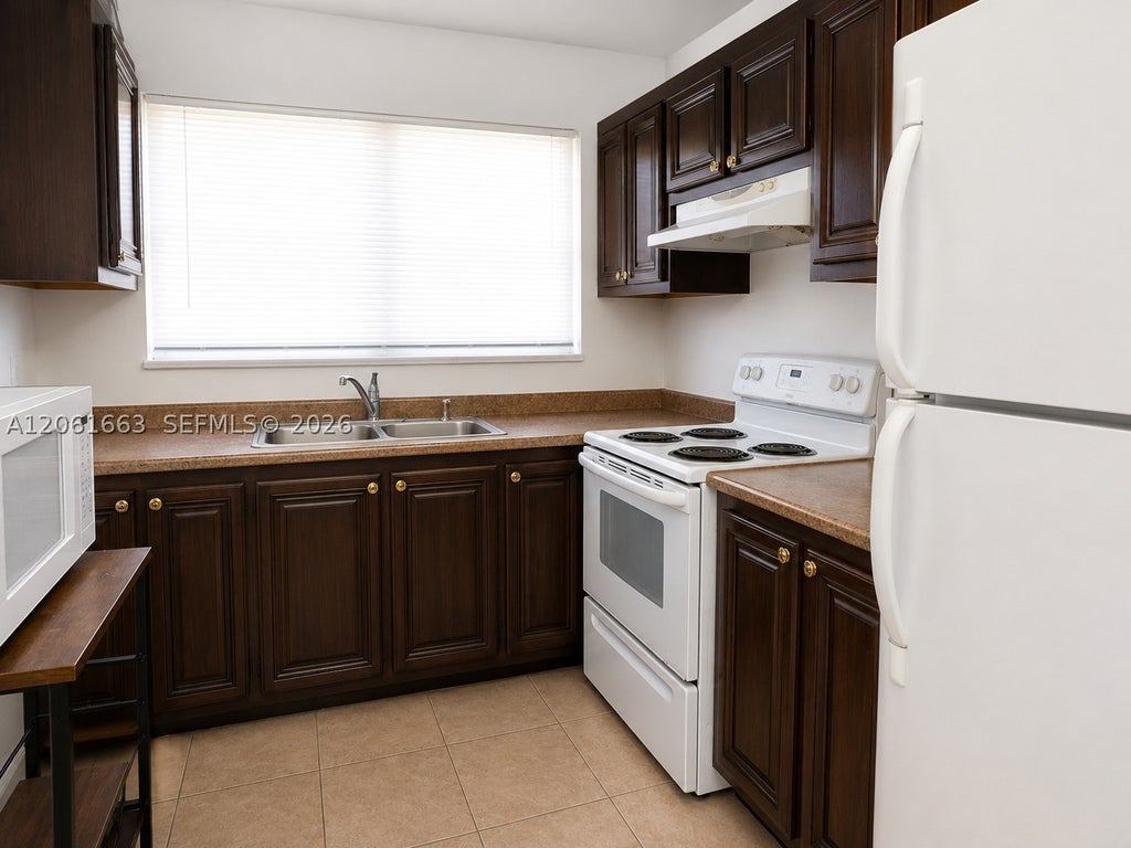 Photo of 4044 NW 19th St #401, Lauderhill, FL 33313 (MLS # A12061663)