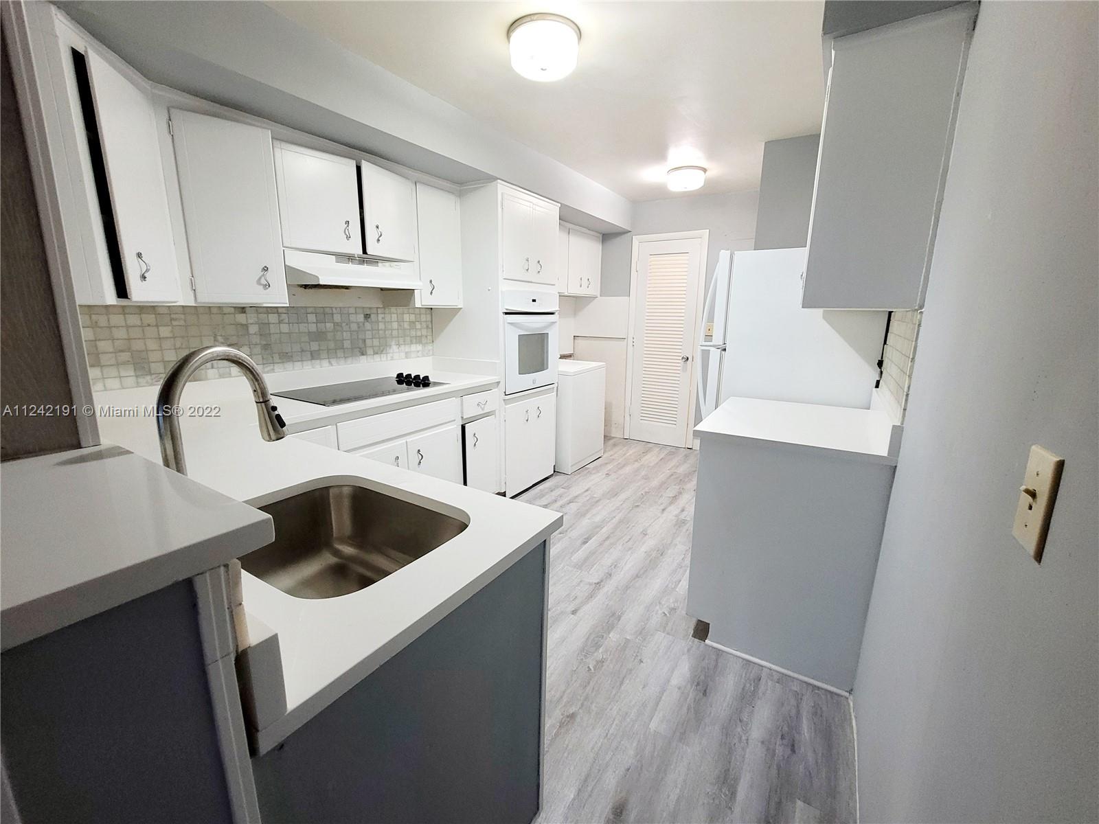 FEELS LIKE A HOUSE. EAST OF US1. Enclosed Patio, Washer/Dryer on unit. TWO parking spaces right in front of the unit. Spacious 2 Bedroom/1 First Floor APARTMENT. Modern floors, HUGE Kitchen with Quartz Countertops and
breakfast counter. TONS of Storage, plenty of closets. Large Pantry. NEW SPLITS AC System in each room. Fast Approval. Building is nicely Fenced. Small Pet: Possible with extra fee. Only $200/month extra for water & electricity. Don't miss the opportunity to live in the prestigious community of Coral Ridge Country Club in Fort Lauderdale. Close to the beach, shopping centers & more. Available August.