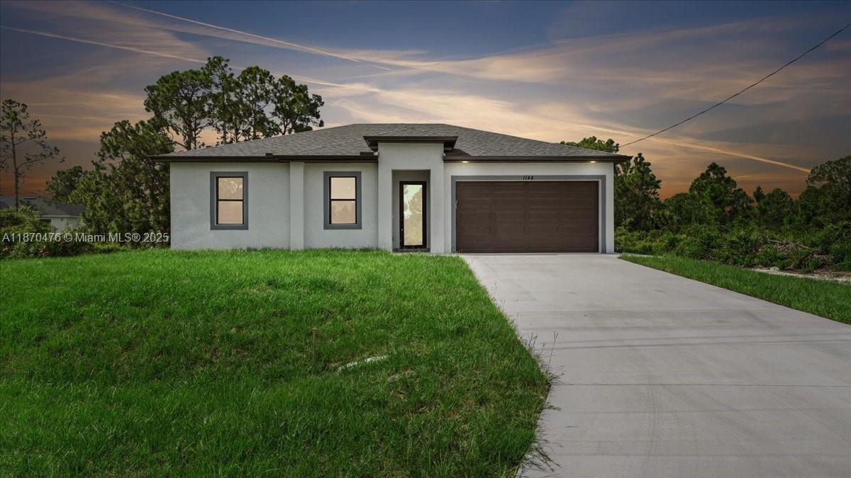 Welcome to this 3-bedroom, 2-bathroom home located in a prime area of ??Lehigh Acres, near SR-82. It boasts 1,270 square feet of living space and 1,699 square feet of total built-in area. This property offers an inviting layout with three bedrooms and two bathrooms, spacious living and dining areas, and a two-car garage for added convenience. Enjoy Florida living with a large backyard, perfect for gardening, pets, or future exterior improvements. Conveniently located near schools, shopping, and major thoroughfares, it's move-in ready and waiting for your personal touch!
