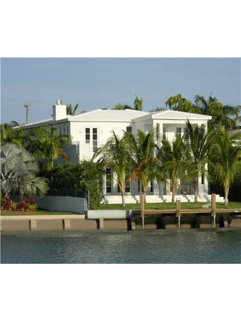 New construction. Corner-Waterfront. Pristine, tropical, modern. 4,922 sqft Five beds up with lovely terraces, one bed down. 5 full & one half bath. High ceilings. Abundance of large windows create luminous rooms. Full cabana bath, outdoor summer kitchen, sparkling pool, covered patio, seawall and dock. Marble floors, formal dining room, exquisite lighting fixtures, 2 car garage, eat-in kosher kitchen. Great sunsets! Prestigious town of Surfside with A+ schools, new community center. Walk to the ocean!