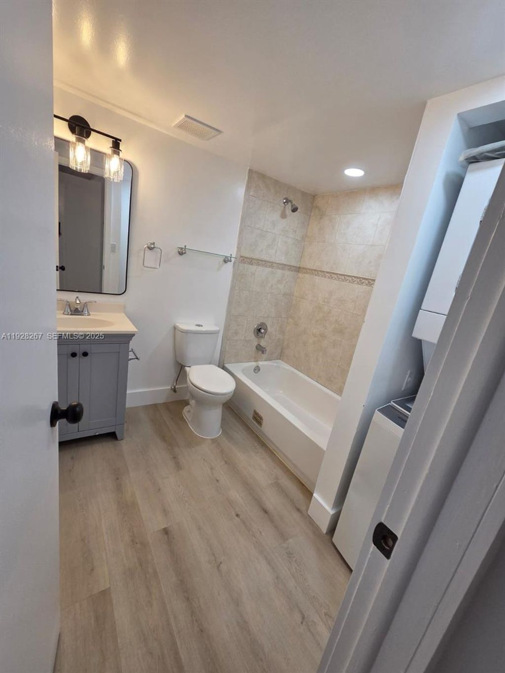 Photo of 10023 Winding Lake Rd #104, Sunrise, FL 33351 (MLS # A11928267)