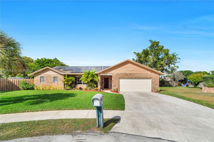 Discover this spacious 3BR, 2.5BA home in sought-after Marcano Estates, Plantation! Offering 2,801 sq ft of living space on an oversized 16,560 sq ft lot at the end of a quiet cul-de-sac. Inside, enjoy an open floor plan with soaring volume ceilings that create an airy, elegant feel, an oversized family room with fireplace, a large sunken living room, and a split-bedroom layout for privacy. The primary suite is a true retreat, opening through French doors to a large deck with serene views of the sparkling pool and lush backyard. Step outside to your private oasis, complete with an oversized pool—perfect for sunny Florida days and entertaining family and friends. Additional highlights include dual A/C units (both newer: 2019 & 2021), solar panels for significant energy savings (likely just a nominal connection fee), freshly painted interior/exterior, refurbished sprinkler system, new landscaping, new blinds, and a 2-car garage with updated walls and floor. No HOA! A perfect opportunity to renovate and customize in a peaceful neighborhood close to parks, schools, shopping, and major highways.