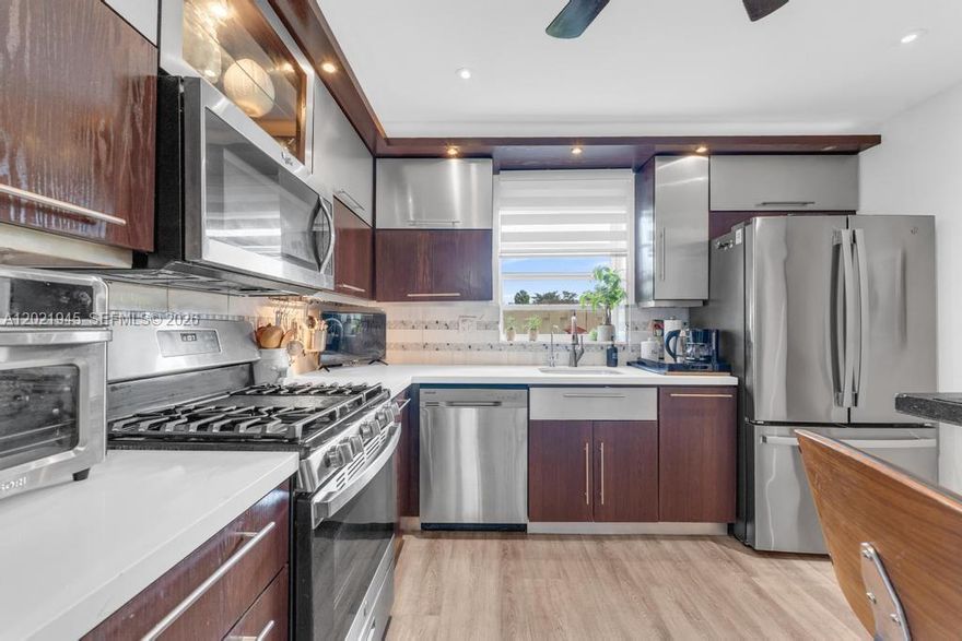 The moment you walk through the front door, the peaceful CANAL view immediately draws you in. This beautifully UPDATED WATERFRONT TOWNHOUSE offers the perfect blend of comfort, privacy, and convenience in the highly desirable Kendall West area.

Filled with NATURAL LIGHT, the home features MODERN FINISHES and a thoughtfully designed layout ideal for everyday living and entertaining. Upstairs, BOTH BEDROOMS ARE SUITES WITH CUSTOMIZED CLOSETS. The primary suite also has a WALK-IN CLOSET.

Downstairs, a half bath for guests, SEPARATE LAUNDRY ROOM WITH FULL SIZE WASHER AND DRYER, and ADITTIONAL STORAGE under the stairs add valuable functionality. Buyers will also appreciate that the kitchen range and the dryer both run on natural gas, not electricity.

Located in the GATED Centre Court community with NO PET RESTRICTIONS. The community POOL is right by the end of the block. INVESTORS MAY RENT IT IMMEDIATELY. It is also directly across from OLYMPIC PARK and minutes from Kendall Drive, shopping, dining, schools, hospitals, and the library. This MOVE-IN READY home offers the lifestyle, location, and value buyers are looking for.