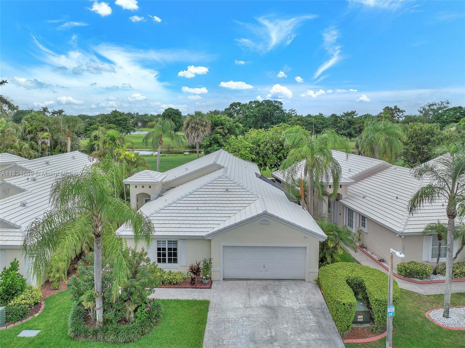 Spectacular remodeled, golf front 3 BR, 2 bath single family home in Wilshire of resort-level manned gated Grand Palms community. Newer roof, 2021 full impact hurricane windows, 2023 water heater, newer ac. Fully remodeled kitchen and bathrooms, fully screened patio, 2-car garage, 2-car driveway. Walk to Whole Foods, other shopping, dining, close to entertainment, parks, superb hospitals, great Broward County schools and I-75 for easy commutes. HOA includes manned gate, 2d residents-only gate, cable, internet, alarm, yard maint, irrigation, painting, tot lot, much more.No golf membership required.