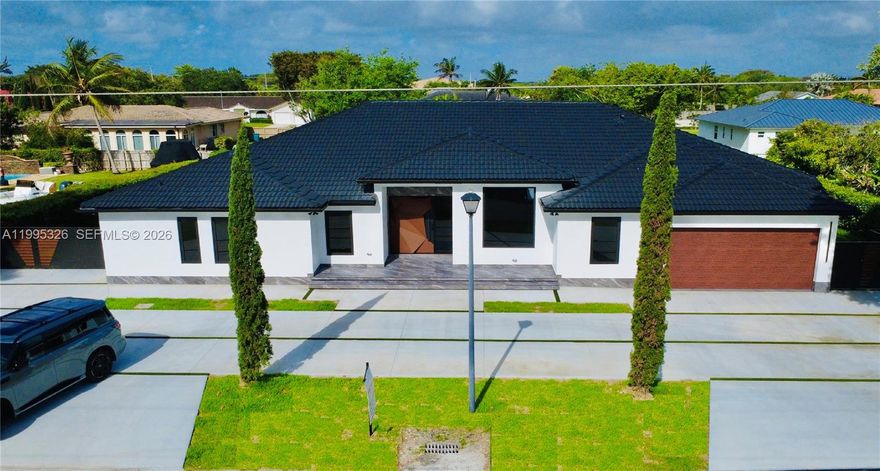 Be the first to enjoy this Modern Miami Single Family House. Enjoy luxury features in this beautifully designed house. Large lot and Interior sq ft area with 5 bedrooms 3.5 baths and 2 cars Garage + New Pool. Solid build with attention to details in every aspect. Large 40x20 ft heated pool, w/ salt system with lots of entertainment area and a spa / hydromassage for 8 people. New Impact Windows and doors. If you like quality and modern style and are looking for lot of interior and exterior space for your property, this is your opportunity. The kitchen is very big and modern. Installed 48x48 Spanish tile flooring this one level house with No HOA and located in one of the most desirable neighborhoods in the area. Driveway fits easily 10+ cars. Owner Agent