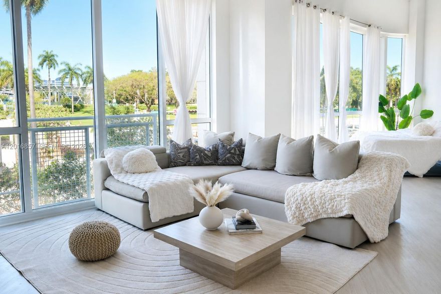 Tastefully furnished, move-in ready, this stylish Downtown Miami residence blends modern sophistication with an airy, light-filled design. Soaring 14-foot ceilings and dramatic oversized windows flood the space with natural light while showcasing lush park views and the vibrant city surroundings. This thoughtfully designed residence offers an open-style den, modern finishes, and a seamless blend of comfort and sophistication. Thoughtful upgrades, including a sleek smart toilet, add a touch of modern luxury that complements the home’s refined aesthetic. The open-concept layout enhances both functionality and style, making the residence feel exceptionally spacious. Residents enjoy resort-style amenities including bayfront pools, a luxury spa, and a state-of-the-art fitness center. Positioned in the heart of Downtown Miami near Bayfront Park, Kaseya Center, world-class dining, shopping, entertainment, and the waterfront.