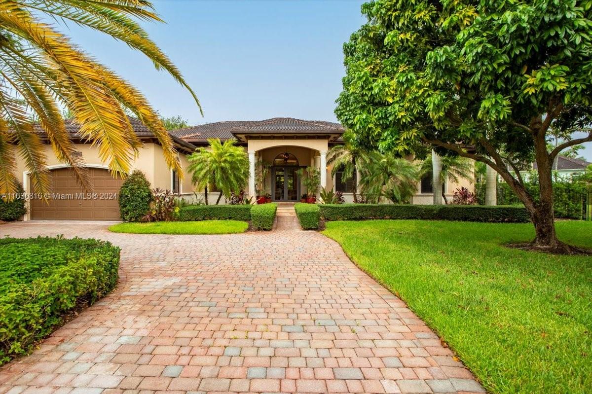 Sophisticated Mediterranean estate in a prestigious enclave behind Baptist Hospital. This timeless home offers 5BD, 4Bth & theater/family room. Enjoy grand living spaces with soaring ceilings, separate living and dining rooms, a gourmet kitchen with a granite island, small cellar, new stainless-steel appliances, and a charming breakfast nook flowing into an entertainment space with an elegant large wine cellar. The home features travertine & Italian-wood-look flooring. The master suite has a spa like Bath, dual sinks, a separate shower & whirlpool tub, and two spacious walk-in closets. The exterior includes a large circular driveway, 2-car garage, heated pool & jacuzzi and landscaping. Other features are new AC, impact windows, a surround sound music, mosquito repellent, security cameras.