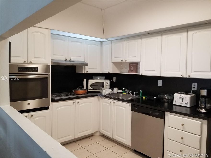 Beautiful 2 Bed / 2 Bath - Corner - Tile & Wood Floors - All Redone - 6  Closets - Cover Parking - Gym - Pool - Tennis - Convenient Store - Across from The Ocean -  Building allowed  Seasonal Rentals - This is a Money Maker - Call Now !!!