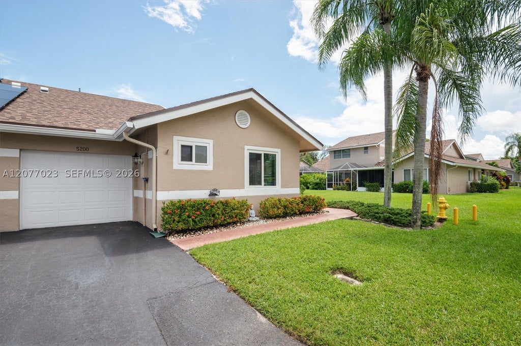 Photo of 5200 W Lakes Dr, Deerfield Beach, FL 33442 (MLS # A12077023)
