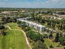 Photo of 8461 Springtree Dr #303A, Sunrise, FL 33351 (MLS # A12035893)