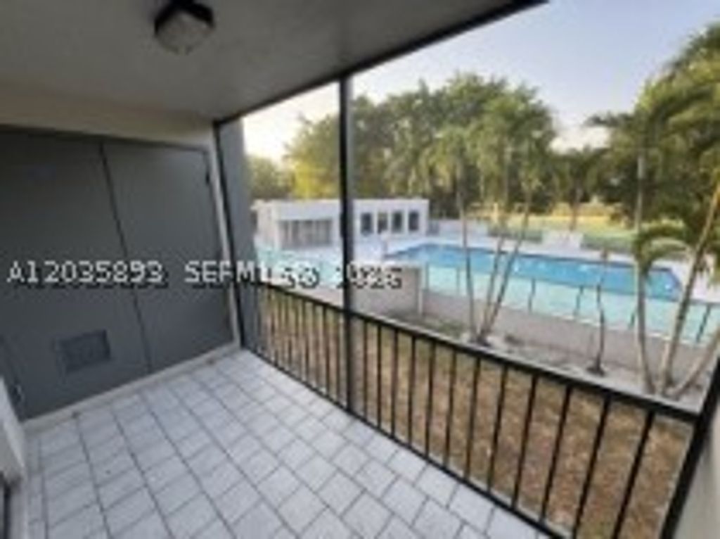 Photo of 8461 Springtree Dr #303A, Sunrise, FL 33351 (MLS # A12035893)