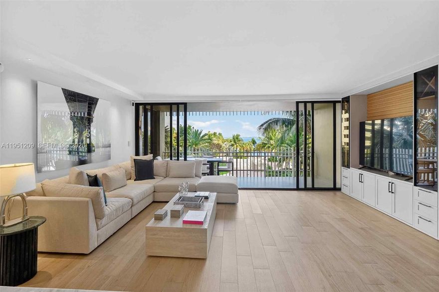 Step into the feeling of a five-star modern tropical resort, perfectly tucked away on the private island of Grove Isle. This stunning 2-bedroom, 2.5-bath residence has been completely remodeled and thoughtfully designed down to the finest detail. Finished to the nines, the home features high-end upgrades throughout, including impact windows and doors, double-thick, new interior doors with hidden hinges, motorized shades with true blackout capability, and a full-size laundry room with custom built-in storage.The open chef’s kitchen showcases impressive quartz countertops and premium stainless steel appliances, including a paneled full-size refrigerator and freezer. Additional highlights include a lighted built-in entertainment center, enhanced custom lighting, and California Closets throughout. Warm, natural finishes complement serene views of the pool, lush gardens, sparkling bay, and swaying palm trees—visible just beyond your private balcony. This is island living at its finest, offering a peaceful escape you may never want to leave. Enjoy full services and amenities on this 20-acre private island, including 2 pools, 2 jacuzzi's, 2 gyms, barbecue area and tiki huts, a doggie park, children's playground and a little beach to enjoy the breeze.