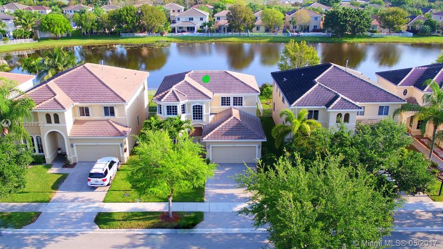 ABSOLUTELY GORGEOUS WATERFRONT HOME IN LAGUNA ISLES. ELEGANT HOME FEATURES OPEN AND SPACIOUS FLOOR PLAN W LIVING, DINING, FAMILY ROOMS, HIGH CEILINGS, KITCHEN W EAT IN COUNTER, GRANITE TOPS, GAS RANGE AND BREAKFAST NOOK. MASTER SUITE ON 1ST LEVEL, MASTER BATH W SPA TUB, DOUBLE VANITIES & STAND ALONE SHOWER. 3 BEDS & FULL BATH W DOUBLE SINKS ON 2ND LEVEL. RELAX IN YOUR SCREENED IN & COVERED PATIO WHILE ENJOYING THE SERENE WATER VIEW. FENCED BACKYARD AND HURRICANE ACCORDION SHUTTERS.  MANNED GATED COMMUNITY WITH AMENITIES THAT INCLUDE POOL, CLUBHOUSE, TOT PLAY AREA AND FITNESS CENTER.