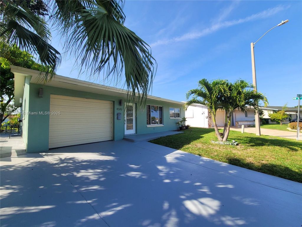 Photo of 4519 NW 49th Dr, Tamarac, FL 33319 (MLS # A11863905)