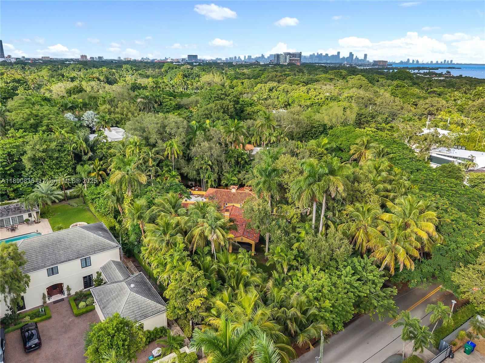 Located in South Coconut Grove, on a 36,620 sq/ft Lot, this Estate, designed by the esteemed Walter DeGarmo, is a Classic, Mediterranean style home with a total of 5,386 Total Area. Whether you would renovate and reimagine the current charm that exists or create a new home of your own, the choice is yours. A new roof and AC's were recently installed. With City of Miami approval, it may be possible to have two buildable lots.