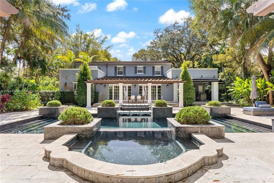 Welcome to a captivating 4/4.5 residence nestled in the prestigious "Golden Triangle." This home seamlessly blends classic elegance with contemporary interiors, situated on an expansive 14,000 sq ft lot. Embrace the epitome of luxury resort living with one of the largest residential pools in Coral Gables, surrounded by a lush tropical landscaped oasis in the backyard. Modern kitchen adorned with pristine white Marble countertops, setting the stage for culinary excellence. Convenience meets indulgence as this home offers the privilege of walking distance to the renowned Biltmore Resort and Spa. With a new roof, impact windows, & doors. Prepare to be enchanted by this unique property, a must-see that promises love at first sight. Don't miss the opportunity to make this special home your own.