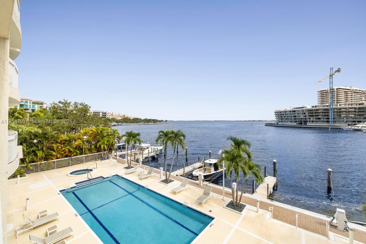 Discover refined coastal living in this spacious 2-bedroom, 2-bathroom plus den residence in the heart of Coconut Grove. Offering 1,530 sq. ft. of interior space and an impressive 800 sq. ft. terrace, enjoy breathtaking oceanfront views and seamless indoor-outdoor living. A deeded boat slip accommodates up to a 40' vessel with direct ocean access, perfect for boating enthusiasts. Located in a private 15-residence boutique building with just two units per floor and 24/7 doorman service, this home offers exceptional privacy and security. Recent upgrades include a new A/C unit (2024), washer/dryer, and refrigerator. Ideally situated near parks, marinas, and Coconut Grove’s vibrant dining and shopping, this rare waterfront opportunity blends luxury, convenience, and tranquility.