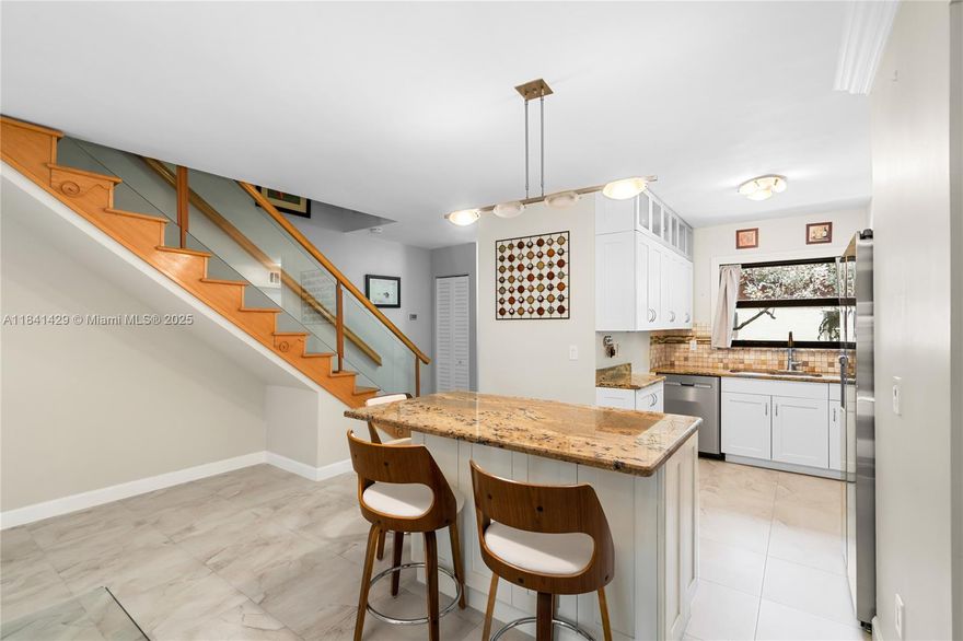 Beautifully remodeled one-of-a-kind, 1,638 sq ft unit in Sandpiper Point—the largest model in the community. Flexible layout offers a massive master suite with den or can be converted to a 3-bedroom. Features include engineered oak wood floors upstairs, italian tile floors downstairs, new roof (2024), brand-new washer/dryer & refrigerator, outdoor A/C (2019), indoor A/C (2013) and impact windows. Master has walk-in closet, den, and ensuite with shower. Second bedroom has full bath with jetted tub. Guest half bath on first floor. Located across from West Lake Park with kayaking, playgrounds, tennis & more. Less than 10 minutes to the beach!