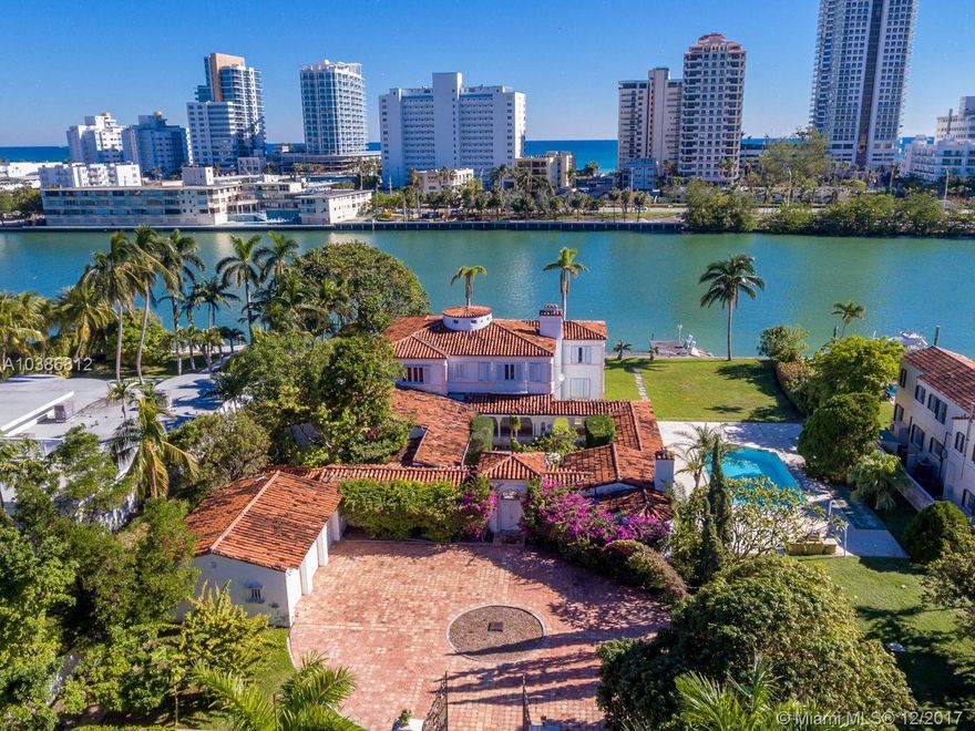 Opportunity to own last large piece on guarded Island, one block from the ocean! Priced to sell, with 150 ft of waterfront. This exclusive Island is poised to appreciate exponentially. 4 new homes built in last few years + 3 more currently being built. All estate waterfronts only no interior lots. Restore this Grand Dame or build new. Possibility of lot split. New guard house in the works.