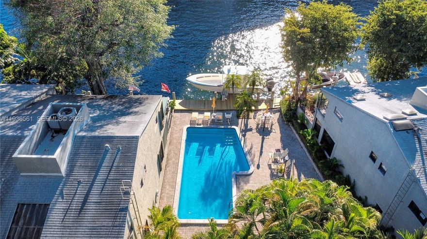 This is a rare opportunity to acquire a two-bedroom, two-and-a-half bathroom townhome in one of Miami's premier communities, Snug Harbor. I like to call it a village! You’ll live in a secluded and gated, pet friendly, densely landscaped compound with water features, a riverfront boardwalk, and a community pool (where you can see the yachts cruise by) located in historic Spring Gardens along the Miami River. The primary suite, second bedroom and guest bathroom are on the second level with the powder room (half-bath) on the first level. Plus, this unit has an attic that could be converted to an office. This prime setting offers convenient access to Downtown, Brickell, Coconut Grove, Key Biscayne, Wynwood, UM/Jackson Medical Campus, Marlins Park, airport, beaches, and major highways. This unit also has two covered parking spaces.