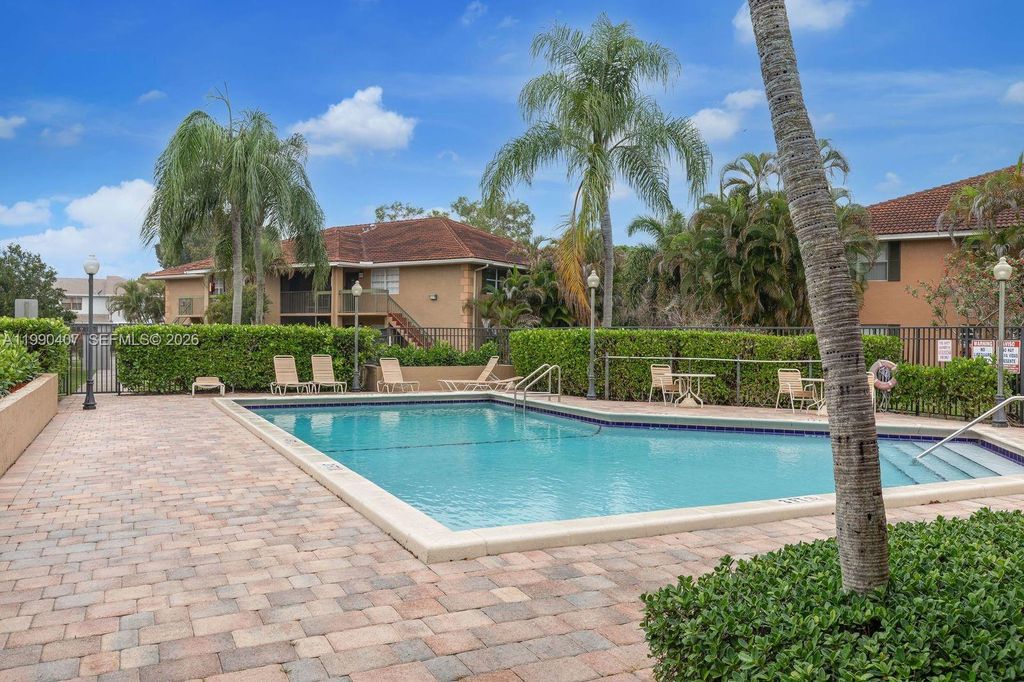 Photo of 10330 NW 8th St #104, Pembroke Pines, FL 33026 (MLS # A11990407)