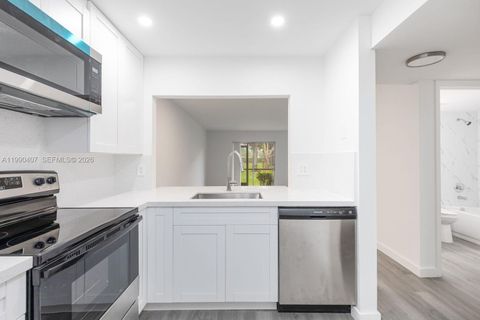 Photo of 10330 NW 8th St #104, Pembroke Pines, FL 33026 (MLS # A11990407)