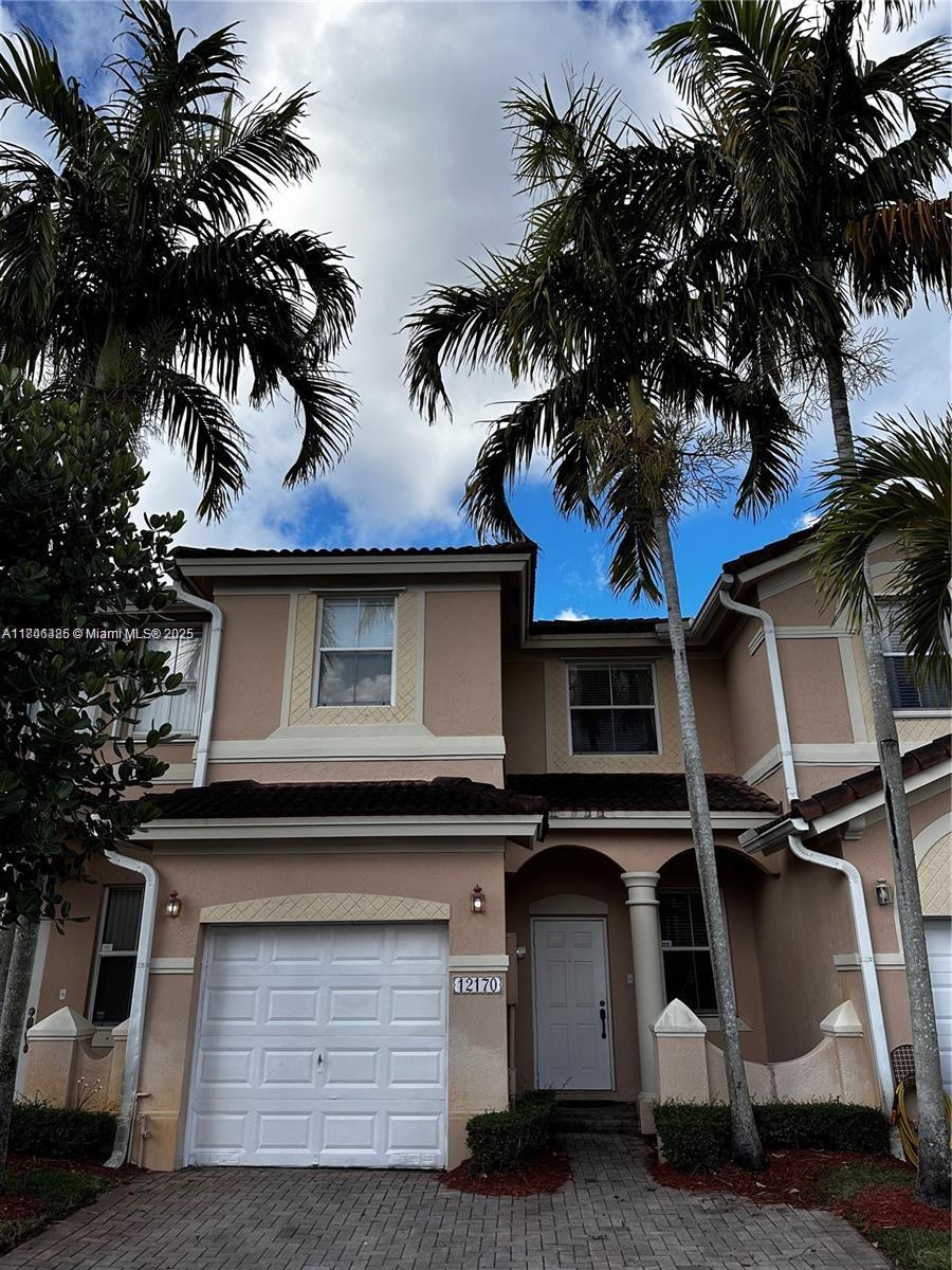 Welcome to 12170 SW 126th Ave, Miami, FL! This well-maintained 3-bedroom, 2.5 bathroom home offers 1,452 sq. ft. of comfortable living space. Featuring its original builder styling, it has never been rented—only used for personal vacations—keeping it in excellent condition. The home boasts a functional layout, a spacious kitchen, and a private master suite. A closed patio provides additional indoor-outdoor living space, perfect for relaxing or entertaining. The property also includes a one-car garage for convenience and storage. As a fee simple home, it is suitable for FHA loans, making it an excellent opportunity for buyers. Conveniently located near shopping, dining, and major highways. Schedule your showing today!
