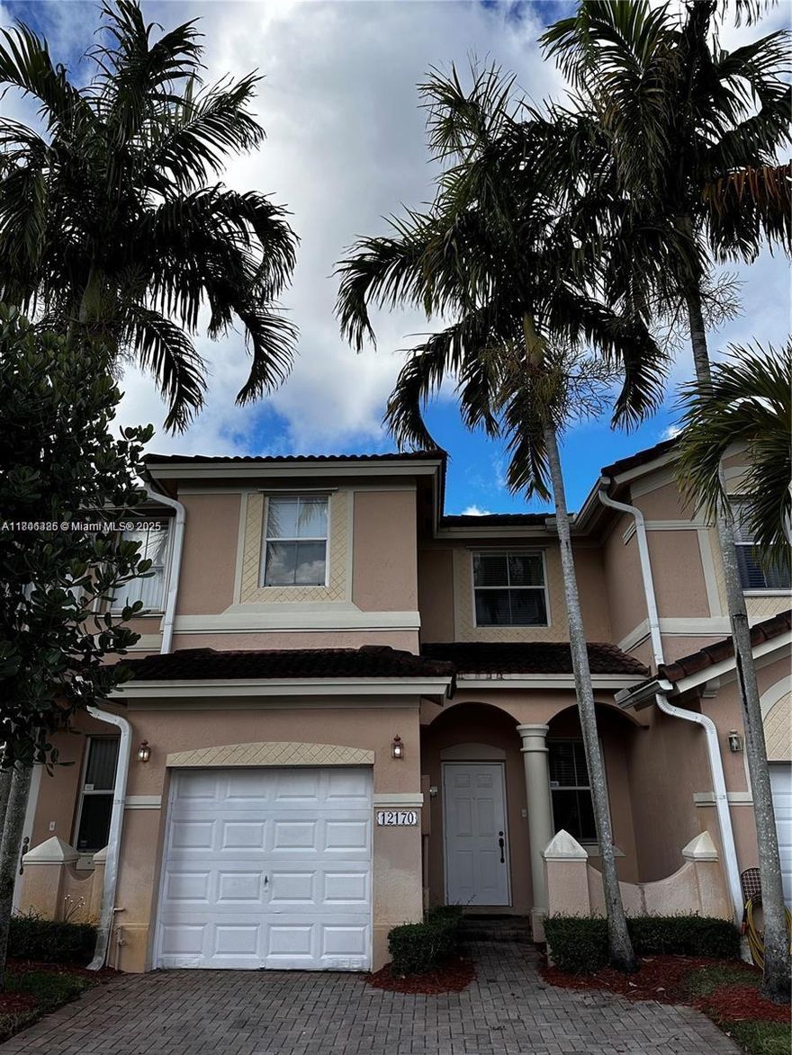 Welcome to 12170 SW 126th Ave, Miami, FL! This well-maintained 3-bedroom, 2.5 bathroom home offers 1,452 sq. ft. of comfortable living space. Featuring its original builder styling, it has never been rented—only used for personal vacations—keeping it in excellent condition. The home boasts a functional layout, a spacious kitchen, and a private master suite. A closed patio provides additional indoor-outdoor living space, perfect for relaxing or entertaining. The property also includes a one-car garage for convenience and storage. As a fee simple home, it is suitable for FHA loans, making it an excellent opportunity for buyers. Conveniently located near shopping, dining, and major highways. Schedule your showing today!