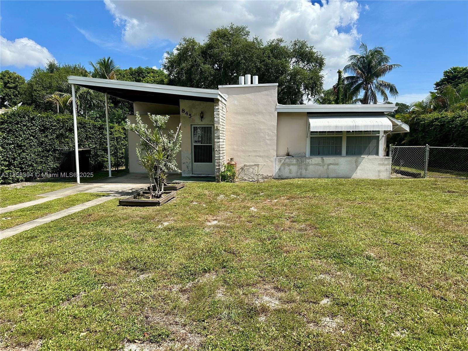 Renovation Opportunity in Prime area in the City of North Miami! This 3-bedroom, 2-bath home offers 1,652 SF of living space and a total of 2,020 SF (including a 1-car carport and covered patio) on a generous 9,100 SF lot (65' x 140'), as per county records. Featuring vaulted wood beam ceilings and a spacious family room, the home is filled with original charm and solid bones—perfect for a full renovation. Owned by the same family for many years, this property needs significant updates, including a new roof, but offers endless potential for customization and value-add. Whether you're an investor or a homeowner ready to take on a project, this is a rare chance to create something special in a desirable North Miami location.Floor plan available!