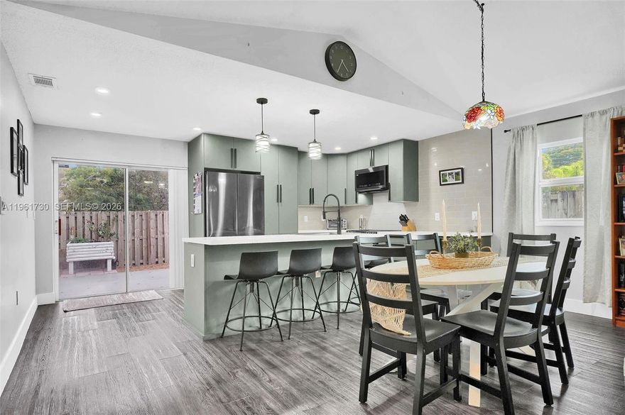 Discover the ultimate family home in this stunningly remodeled 3/2 single-family home, perfectly situated on a desirable corner lot. The heart of the home is the massive, entertainment-inspired kitchen, which was professionally enlarged with permits to create a central gathering hub that you simply won’t find in similar models. Featuring sleek cabinetry, modern finishes, and expansive counter space, it is designed for hosting, and busy school-day breakfasts alike. The thoughtful layout includes a professional garage conversion, providing a versatile third room that perfectly serves as a spacious nursery, a quiet home office for remote work, a TV room for watching your favorite shows, or a vibrant playroom for the kids. Every inch of the interior has been refreshed with beautiful, durable laminate flooring and two completely redone bathrooms featuring contemporary tiling and designer fixtures. Modern peace of mind is guaranteed with a recently updated air conditioning system, ensuring your family stays cool and comfortable during the Florida summers. Step outside to your backyard—a true oasis for children to play safely and for parents to relax or host weekend BBQs under the stars. Being a corner lot, you enjoy extra breathing room from neighbors and a sense of openness. Located near Davie’s top-rated schools and lush parks, this move-in-ready gem offers the space, safety, and style your family deserves. Originally a 2/2, but can be used as a 3/2 with garage conversion.