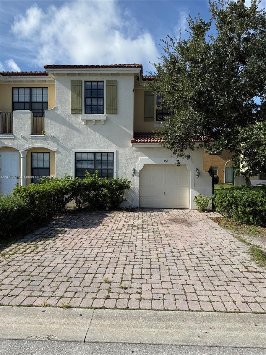Discover comfort and convenience in this spacious 4-bedroom, 3-bath townhome nestled in a quiet neighborhood of Port St. Lucie. The home boasts a bright and airy layout with tile flooring throughout the main level and carpeting upstairs. The kitchen is equipped with essential appliances and generous cabinet storage—ideal for everyday use. The primary suite features a walk-in closet and a private en-suite bathroom with dual vanities. Washer and dryer are included for your convenience. Located just minutes from I-95, and directly behind Walmart and Sam’s Club, with easy access to shopping, dining, and schools. Fast approval process—ready for immediate move-in!