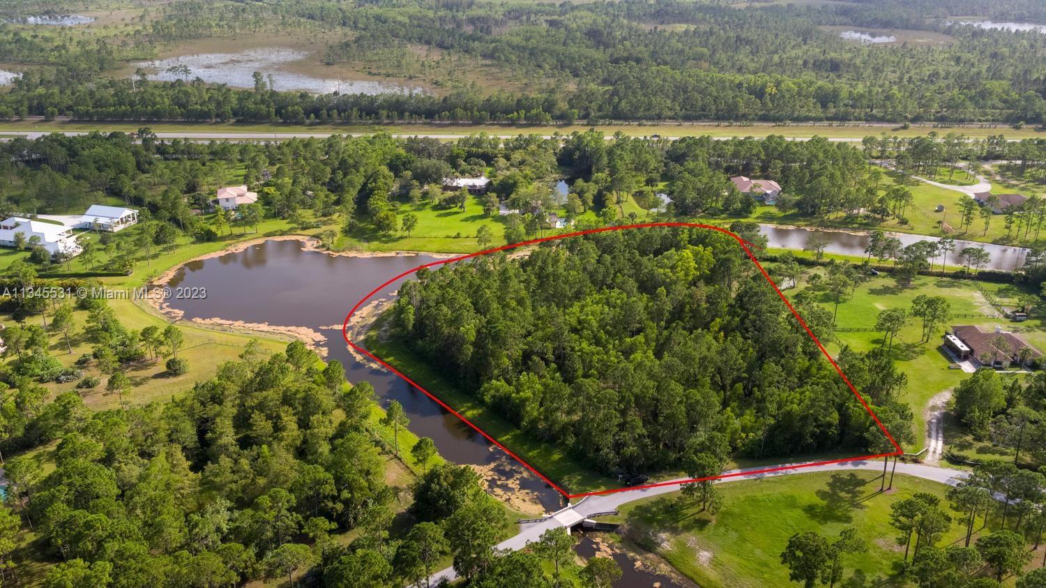 ONE OF A KIND lot in the equestrian community of Caloosa is just waiting for YOU to build the PERFECT CUSTOM
Home! This is the ONLY lot with a wide lake view AND an incredible 1,000+sq ft of wrap around water frontage on
2 sides! Lot is not cleared and is mostly pine trees. Lot lines extend into the surrounding Canal/Lake. See attached
aerial with marked lines in photos. Enjoy sunset views overlooking the water! Caloosa offers their residents 30
miles of bridle trails. You will enjoy resident access to the private 32 acre Community Park which includes Horse
Facilities, Tennis Courts, Basketball Courts, and Playground area. Caloosa is one of the RARE Communities that
offers a Serene, Private Location, with Easy Access to World Class Shopping, Dining, and Entertainment Venues