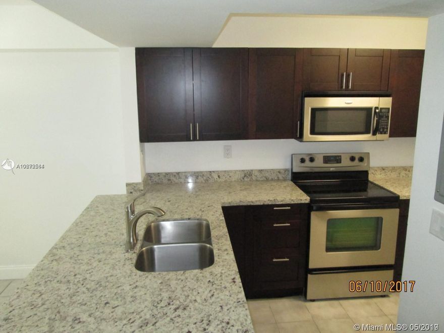 First floor unit!! One of the best condo in the complex. Beautiful 2 beds / 2 baths, very spacious almost 1200 square feet. Fully remodeled, this corner condo has an open concept with gourmet kitchen, stainless steel appliances, granite counter tops and a pantry. Two balconies, upgraded baths, full size washer & dryer, plenty of closets. Tile floors in common areas and berber carpet in bedrooms. Smooth ceiling (no popcorn). Split floor plan. Pool alongside the lake, clubhouse, gym, tennis, children's playground, large BBQ area for picnicking, extensive winding walkway all along water's edge. Don't miss this opportunity! Very close to Black Point Marina. Gated community plenty of visitor's parking.  Three months to move in is a must. No pets allowed.